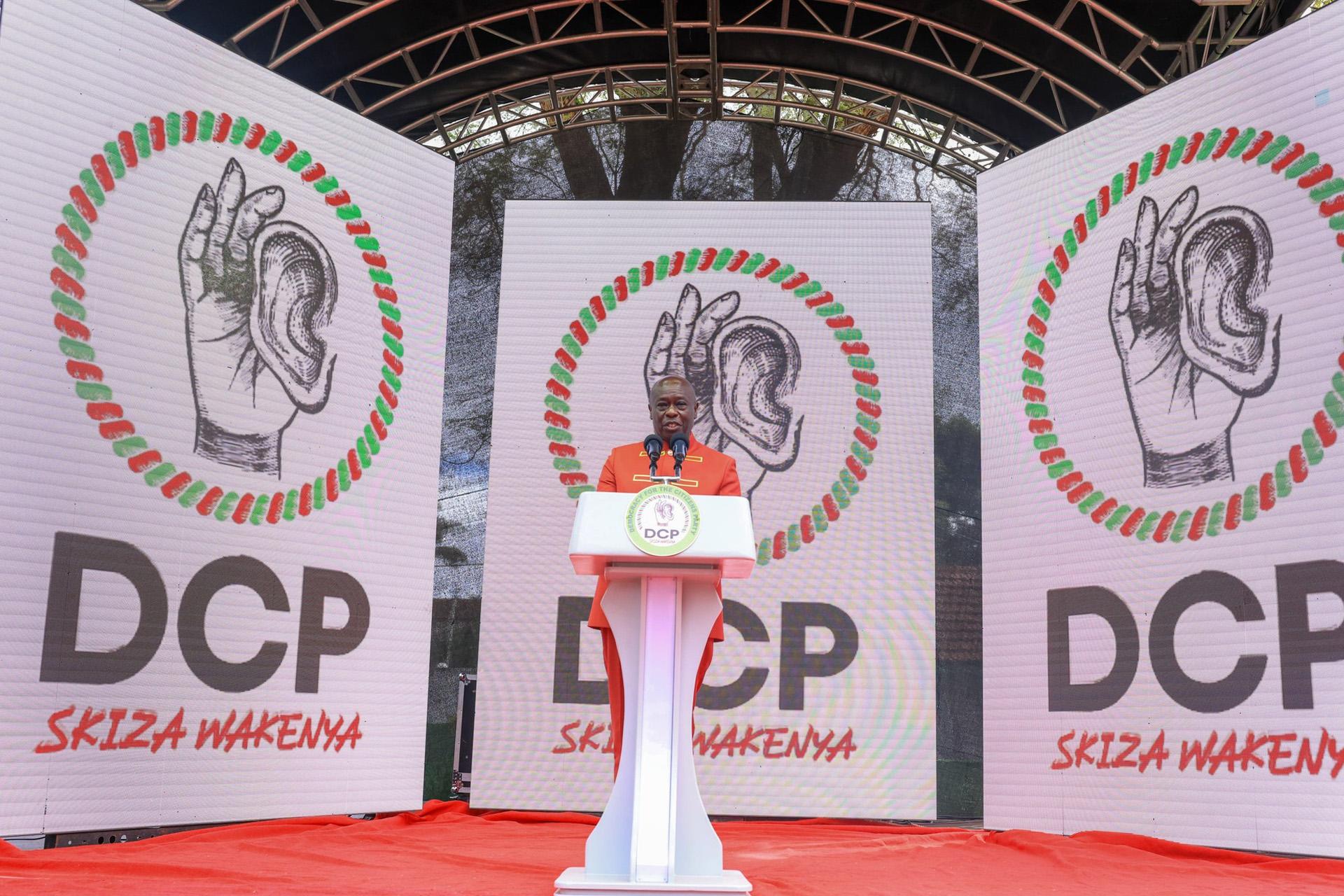 Rigathi Gachagua at the podium between DCP Skiza Wakenya screens